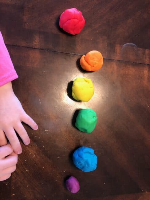 Simple no prep play dough and beads activity for toddlers to learn colors and build fine motor skills using just 2 supplies you have at home.