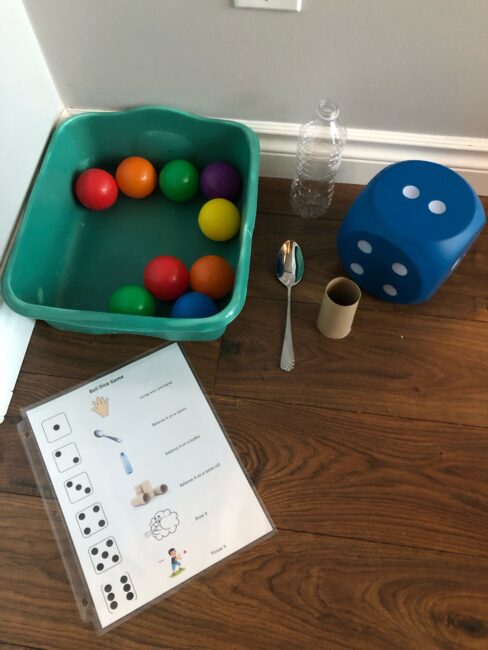 Supplies needed to play ball and dice game.