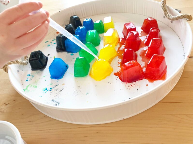 Work on fine motor and sensory play by using pipettes and water to melt rainbow ice.