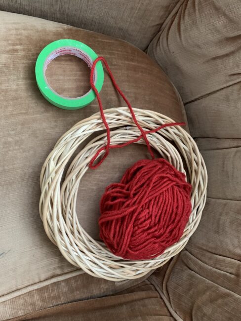 Supplies needed to make a quick and simple hanging target for launching pom poms at.