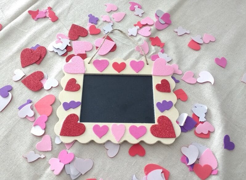 Add foam hearts to a wooden frame for Valentine’s Day with your kids using just 3 simple supplies in this craft. Keep it or share the love!