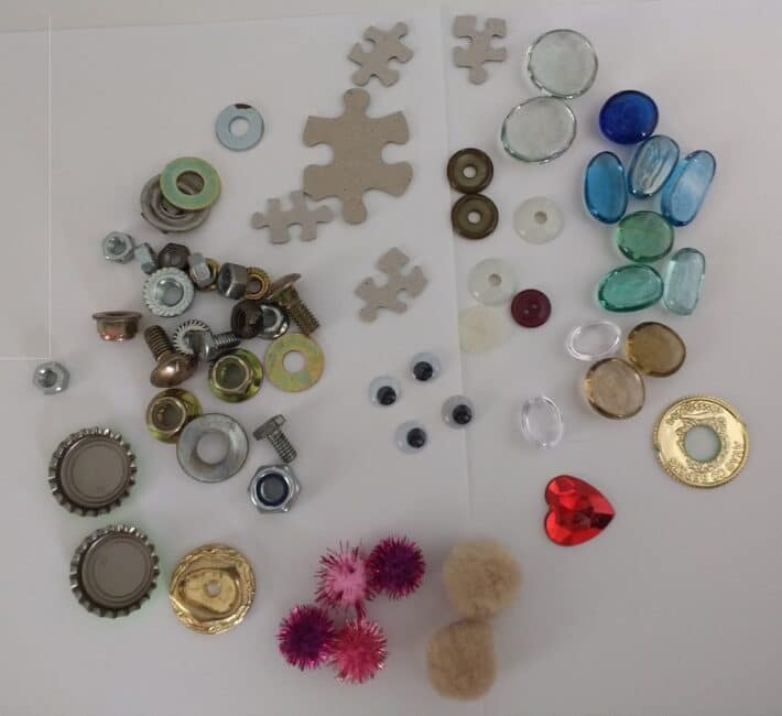 Collection of assorted small items to use to make tin can robots