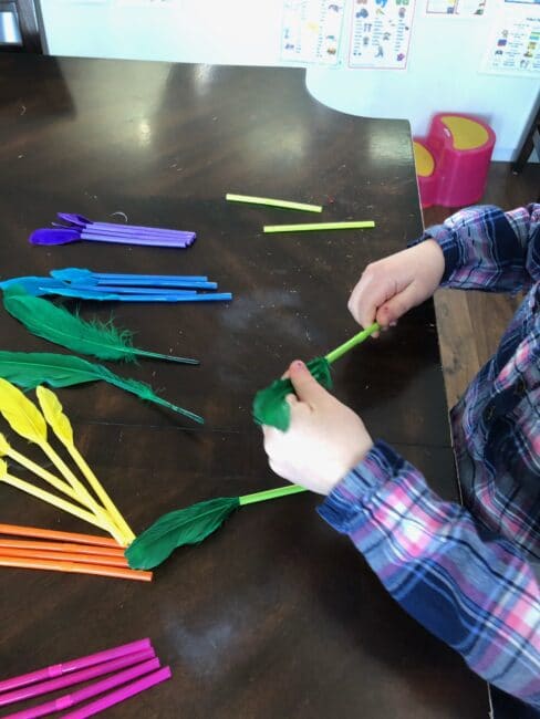 Simple feather and straws color matching threading activity for toddlers and preschoolers at home.