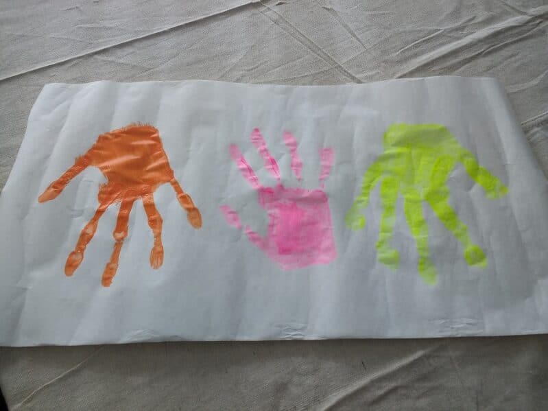 colored handprints painted for Halloween monsters