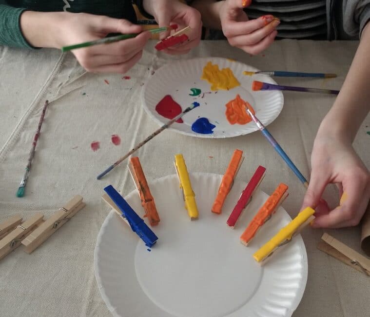 Painting clothespins for Thanksgiving turkey