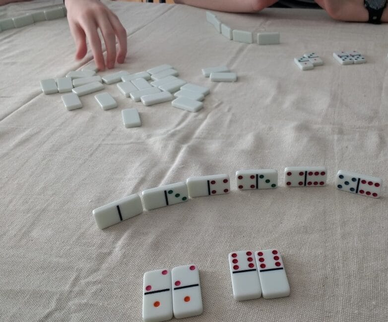 Grab domino tiles and your children and try out 3 fun learning math games at home with these hands on activity ideas using only dominoes.