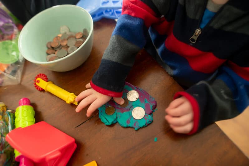 Toddler money exploration math sensory play that is super simple and adaptable for any age!