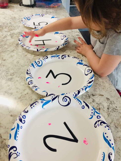 Try this simple preschool number activity and count with finger paint prints!
