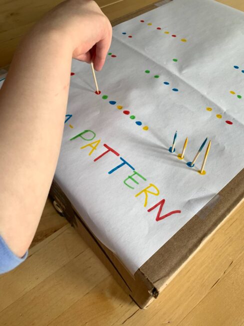 Poke a pattern in a box and work on fine motor, critical thinking, early math and colors with this simple activity for preschoolers at home.