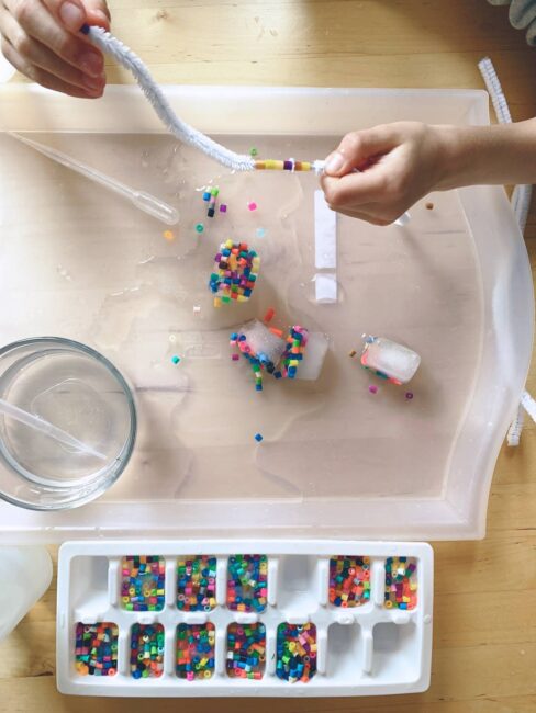 Take fine motor and sensory to a new level with this easy and fun threading beads activity for preschoolers that uses ice!