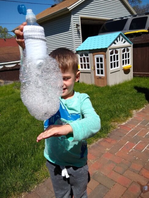 Have some silly sensory fun with this sock bubble snakes activity that simple for toddlers and preschoolers to explore outside together.