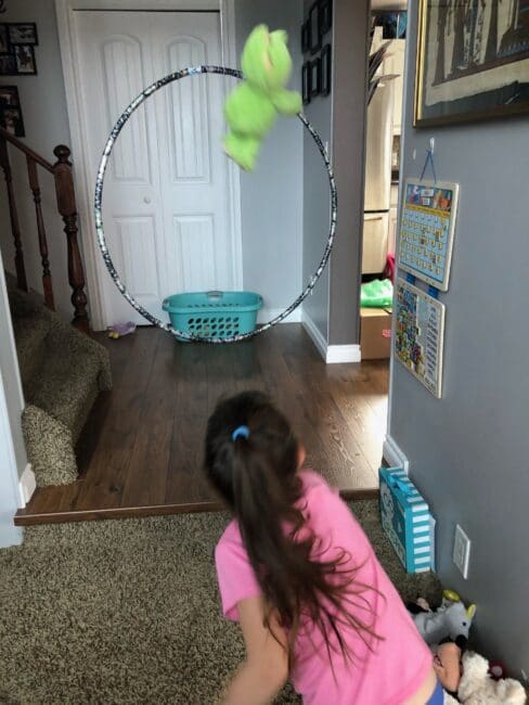 Stuffed Animal Game 2: Target Toss - hang a hula hoop in a doorway or hallway, toss soft toys from one side through the hula hoop and into a laundry basket! Can you hit the target?