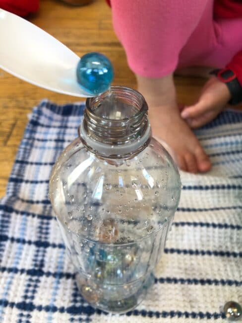 Scoop and transfer marbles and water with this easy sensory activity for preschoolers to have fun at home with free play.