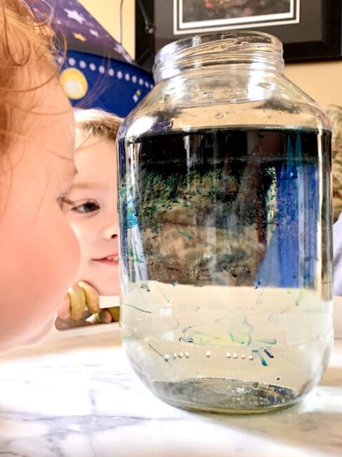 Make your own little shooting stars in a jar galaxy space experiment at home using simple supplies for kids.