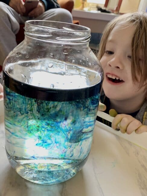 Make your own little shooting stars in a jar galaxy space experiment at home using simple supplies for kids.