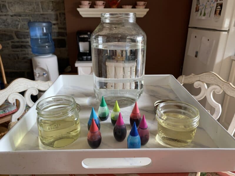 Preparation for an easy space themed science experiment at home for toddlers and preschoolers to create a little galaxy in a jar.