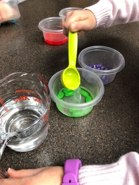 to start the jelly bean experiment, cover each sorted color with water.