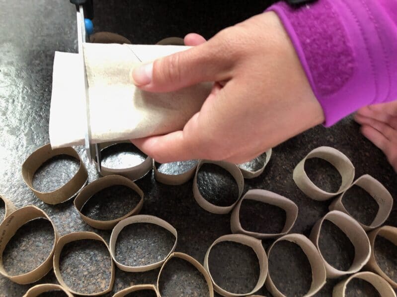 Cut rings with cardboard tubes to create abstract art with your kids.