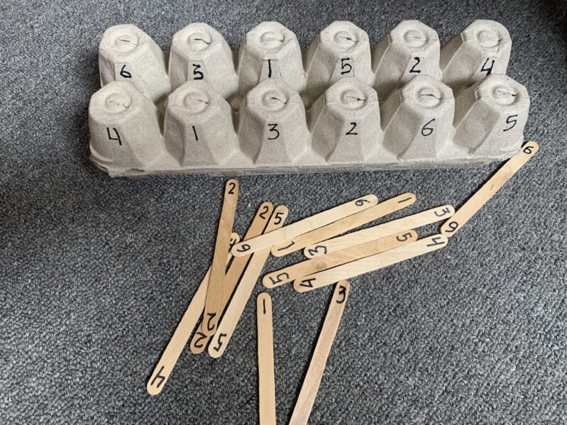 Work on fine motor, color matching, counting, number recognition, or teach upper and lowercase letters with just recycled egg cartons, craft sticks and markers with these simple ideas.