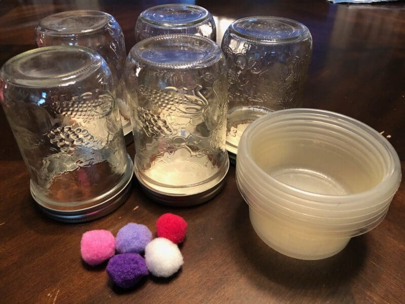 Supplies needed for this pom pom blowing activity to improve speech for toddlers and preschoolers.