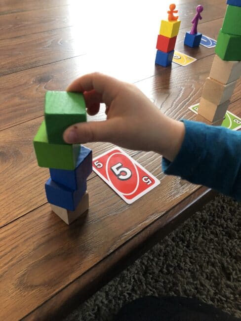 Count the number of blocks to match the card that's flipped over!
