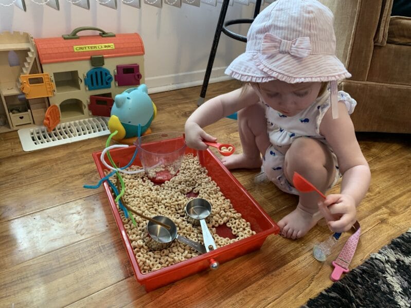 Cereal sensory play is great for toddlers at home.