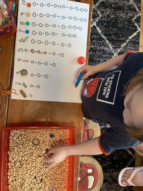 Quick sensory bin stem activity with magnets for preschool kids to work on sorting, counting, and just a lot of fun playing with small parts.