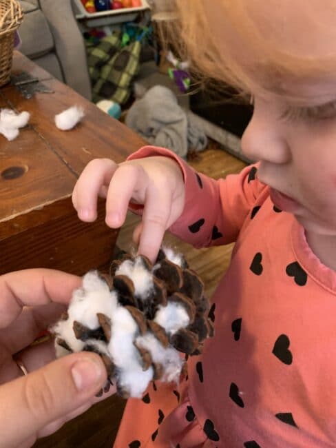 This little pinecone snowy owl craft is just so adorable and the bonus is it’s a great fine motor activity for toddlers and preschoolers using simple supplies!