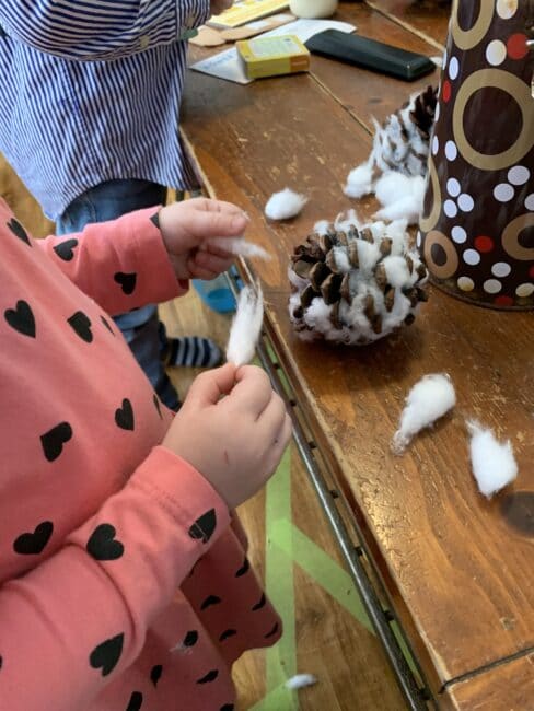 This little pinecone snowy owl craft is just so adorable and the bonus is it’s a great fine motor activity for toddlers and preschoolers using simple supplies!