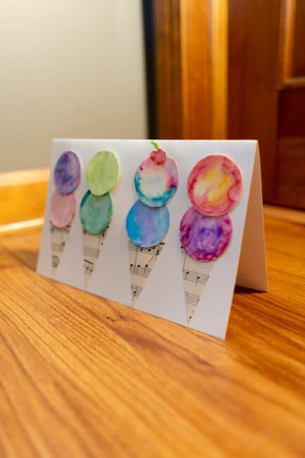 Make this adorable DIY watercolor ice cream cone birthday card with markers, paper and water in this easy how-to guide even toddlers can make!