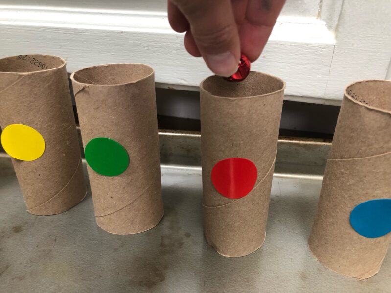 match the colored jingle bells to the colored cardboard tube