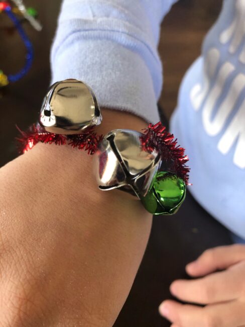 make a jingle bell bracelet or necklace -- or turn it into a Christmas wreath ornament