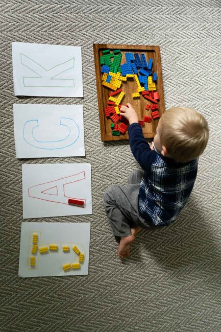 Sort LEGO by colors to make letters or your child’s name with this super simple toddler activity that just uses paper, crayons and blocks!