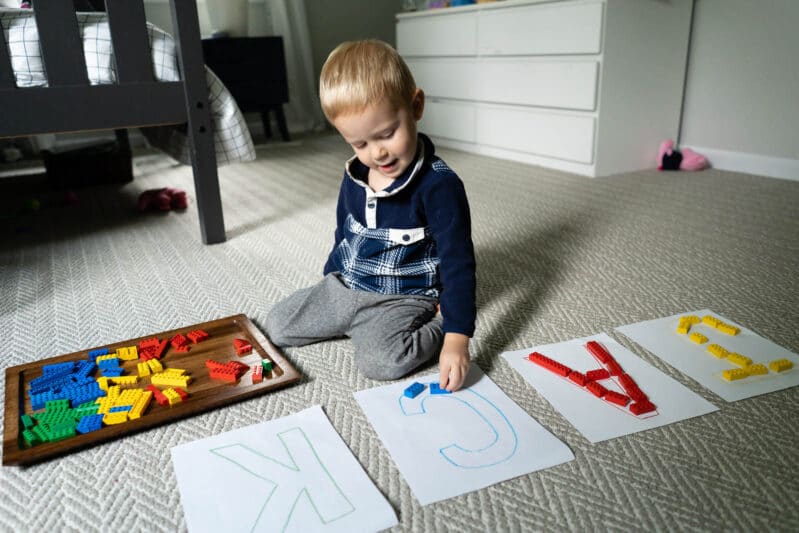 Sort LEGO by colors to make letters or your child’s name with this super simple toddler activity that just uses paper, crayons and blocks!