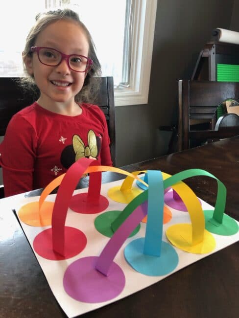 Grab your kids and create an abstract twisted rainbow craft with color matching, and fine motor practice at home!