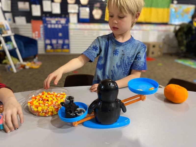 Weighing and comparing objects with a scale made simple a fun for preschoolers with this easy weight activity you can do at home.
