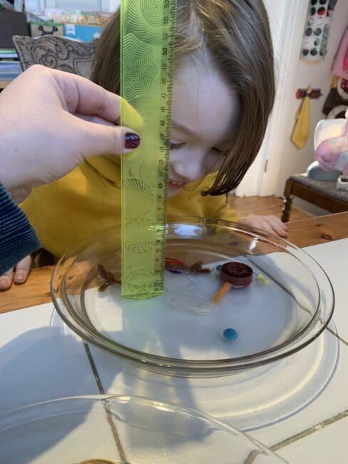 Bring snow indoors to explore measuring with this easy melting snowman science experiment and add a little sensory play to the activity too.