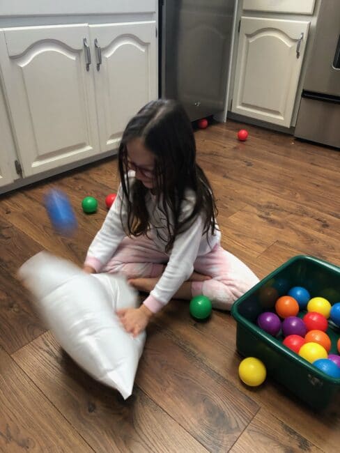 A plastic bag, and a bunch of balls. That’s all you need for tons of fun with this ball popping activity that’s sure to bring on the giggles!