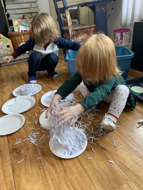 Grab your shredded paper from the office and turn it into an exciting snowman sensory bin experience for toddlers and preschoolers at home.
