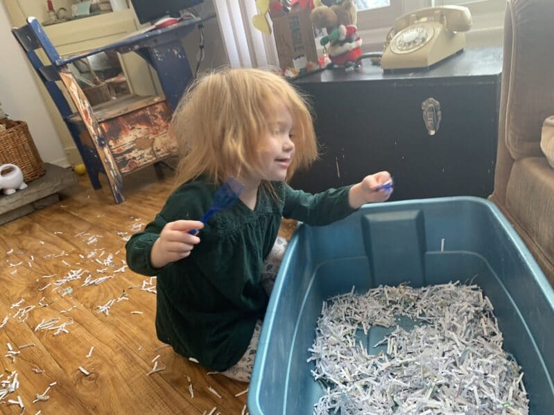 Toddlers and preschoolers will love the sensory experience of playing with shredded paper and building a snowman in the bin or on the floor!