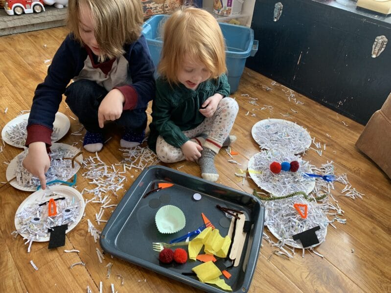 Make use of your home office shredded paper and turn it into a super simple sensory play time building a snowman in the bin or on the floor.
