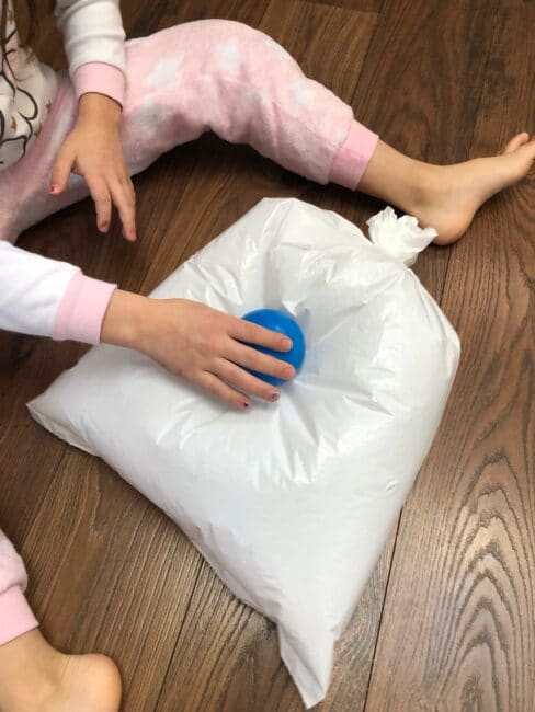 A plastic bag, and a bunch of balls. That’s all you need for tons of fun with this ball popping activity that’s sure to bring on the giggles!