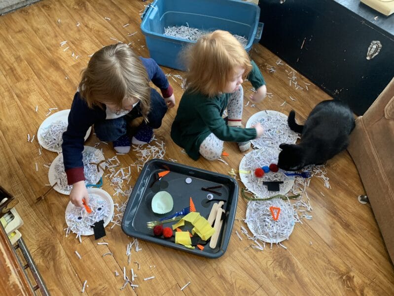 Make use of your home office shredded paper and turn it into a super simple sensory play time building a snowman in the bin or on the floor.