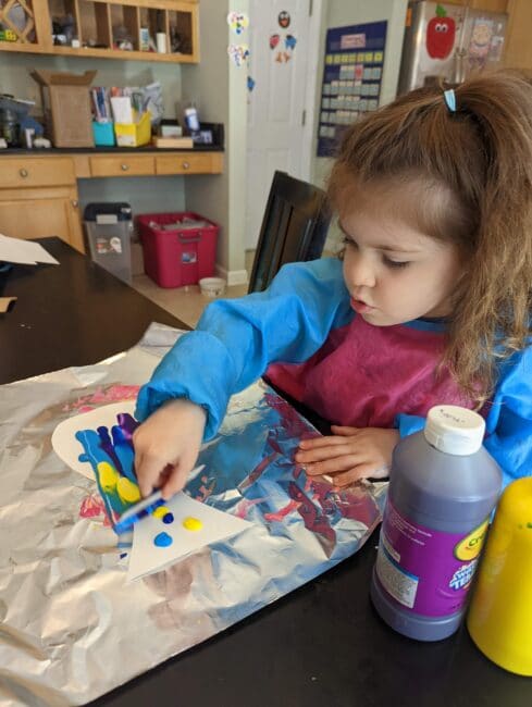 Get creative with this super simple fish art project for kids to try their hand at an easy scrape painting in an ocean theme craft.