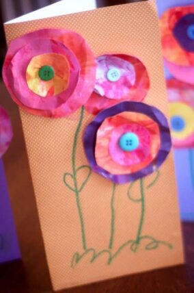 Handmade card with cotton ball flowers and drawn green stems