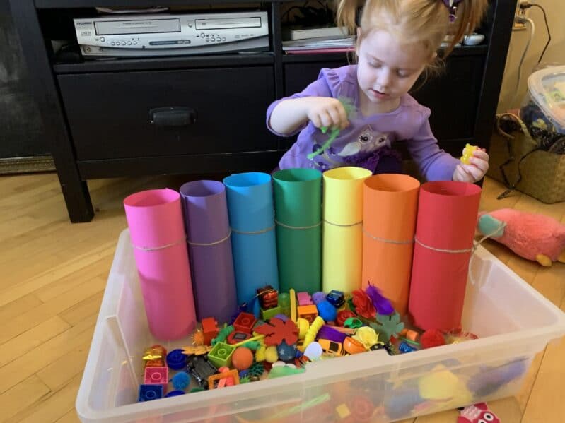 This rainbow sensory bin is totaly mess free! Use toys, craft items, household items and construction paper for a colorful sensory experience!