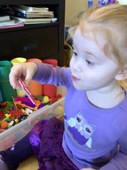 Sort household supplies by the colors of the rainbow in this totally mess free sensory bin idea perfect for toddlers at home.