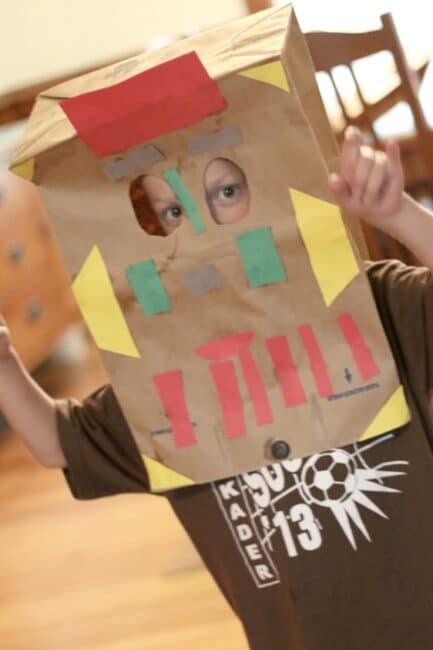 A paper bag mask can be decorated any way the kids like.