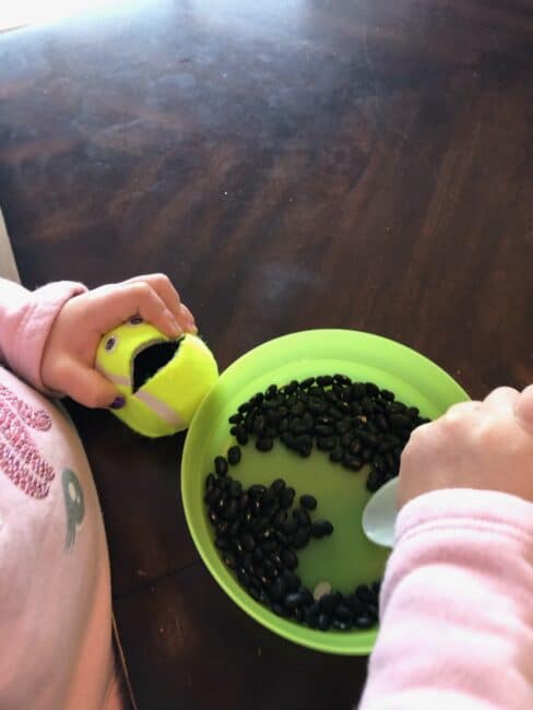 Squeezing a tennis ball is a great fine motor strengthening activity!