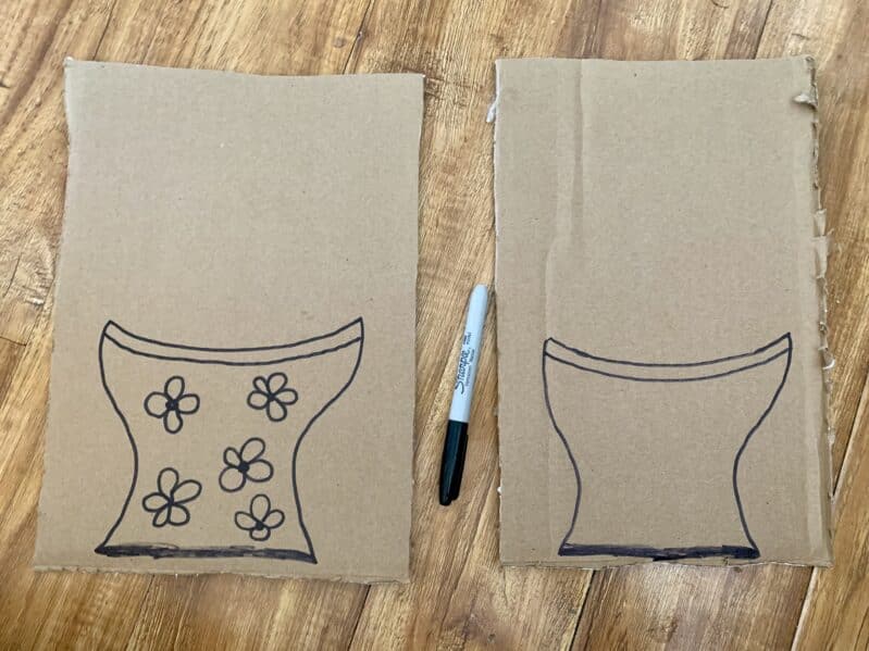 Draw simple vase shapes onto cardboard pieces.
